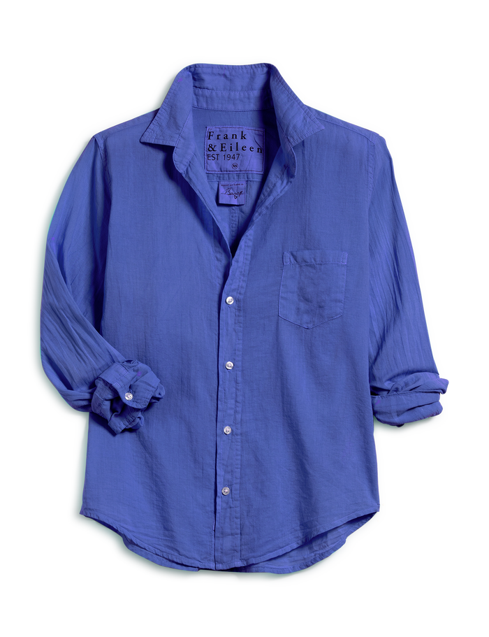 A blue long-sleeve button-down shirt by Frank & Eileen, featuring a chest pocket and rolled-up sleeves, displayed on a clean white background.