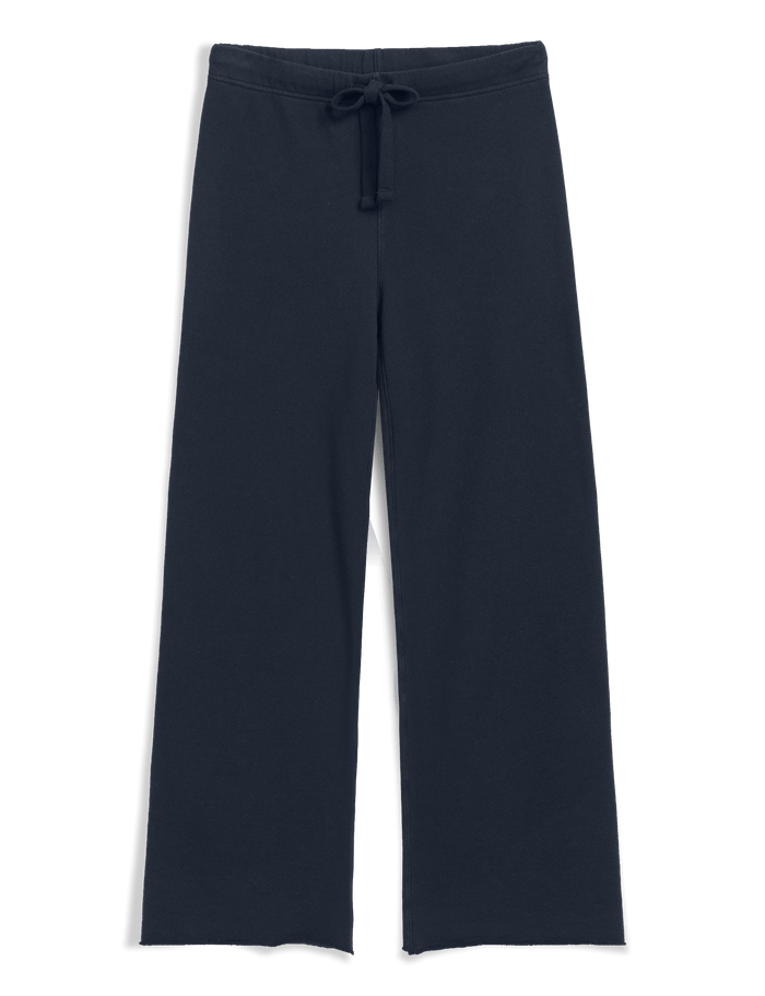 A pair of dark navy wide-leg pants with an elastic waistband and a matching drawstring, shown against a solid black background.