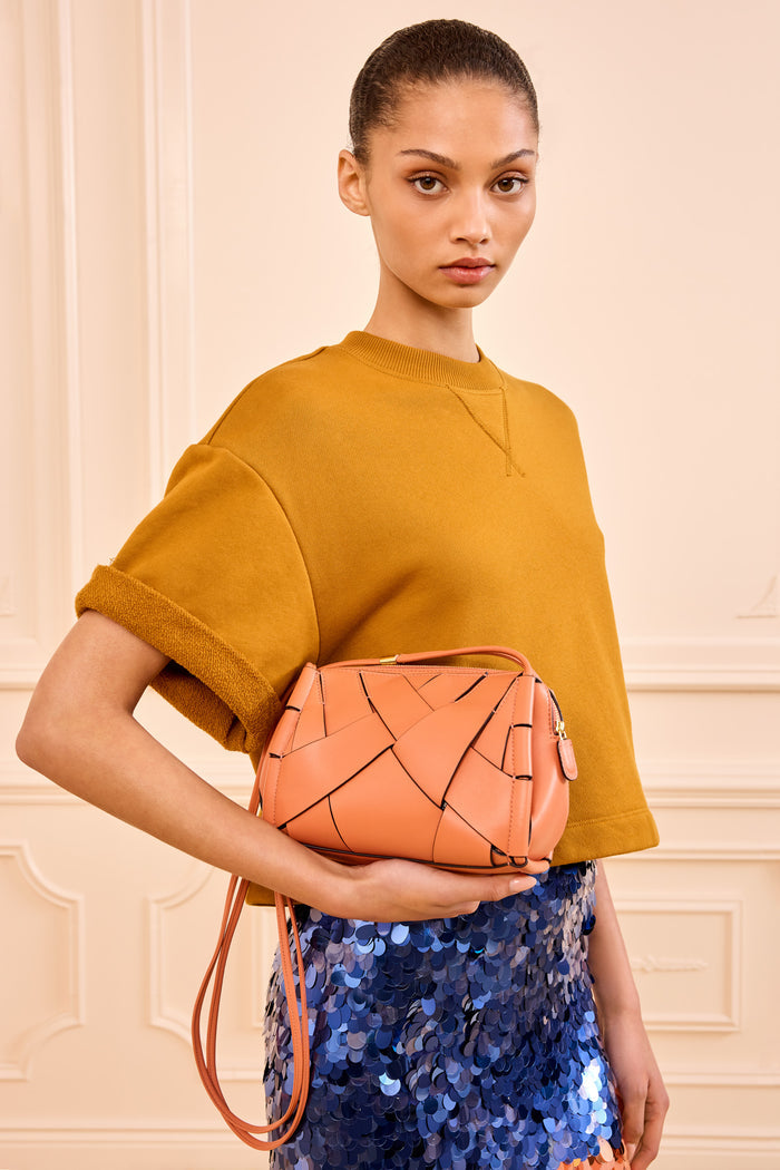 Rose Leather Charlotte Camera Bag Held by Model - Front Styled Look | Ulla Johnson