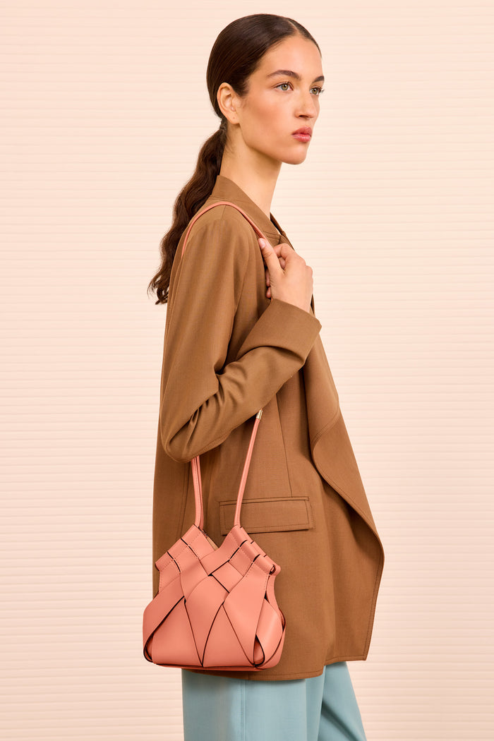 Rose Woven Leather Designer Crossbody Bag Worn on Model - Side Profile | Ulla Johnson