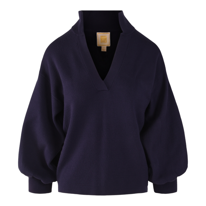 The Lolli Sweater is a deep navy blue, long-sleeve viscose knit with a wide V-neck collar, drop shoulders, and a relaxed fit, shown on a white background.