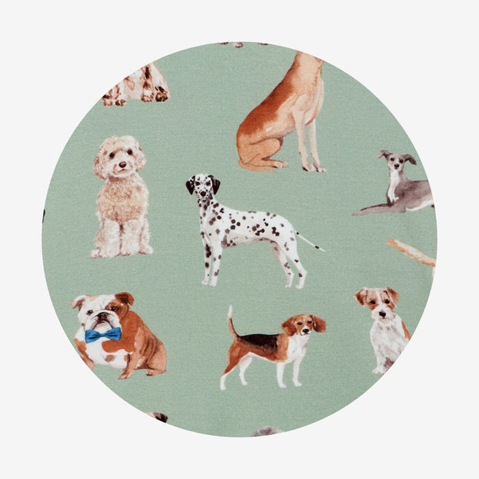 circle swatch of green bamboo viscose fabric with dog pattern print