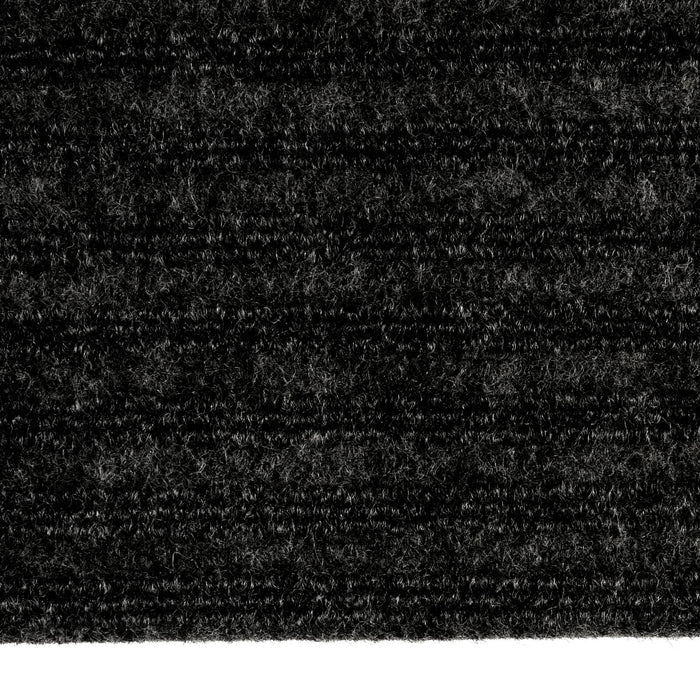 Detail of a black ridged door mat for indoor use