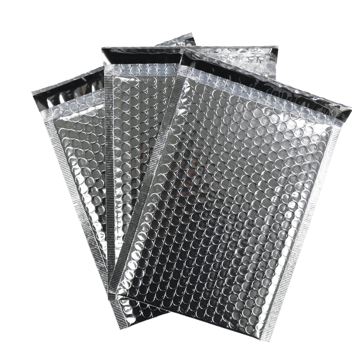 set of 3 silver self sealing bubble mailers on white background