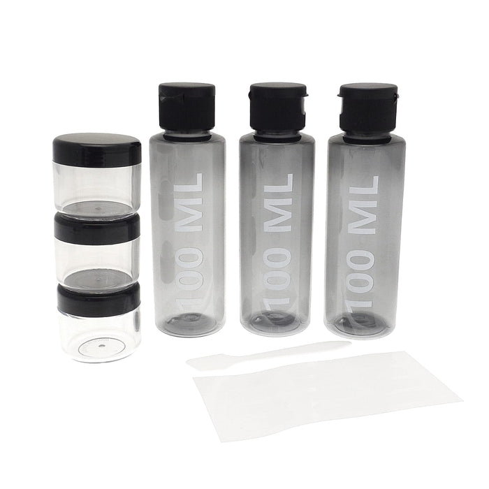 3 100ml bottles beside 3 x 20g storage containers for creams with spatula, travel bottle set