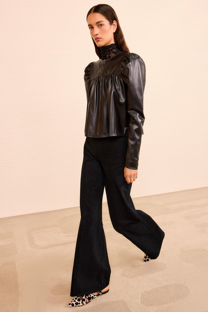 Black Leather Anouk Zip Up Jacket Styled with Wide-Leg Denim - Full Length Side View | Ulla Johnson