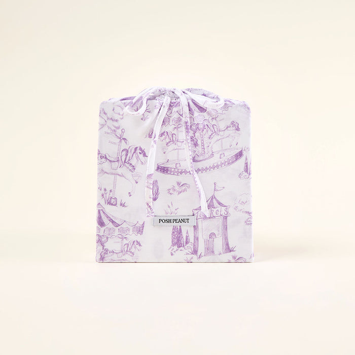 Gift bag with purple castle design on a white background