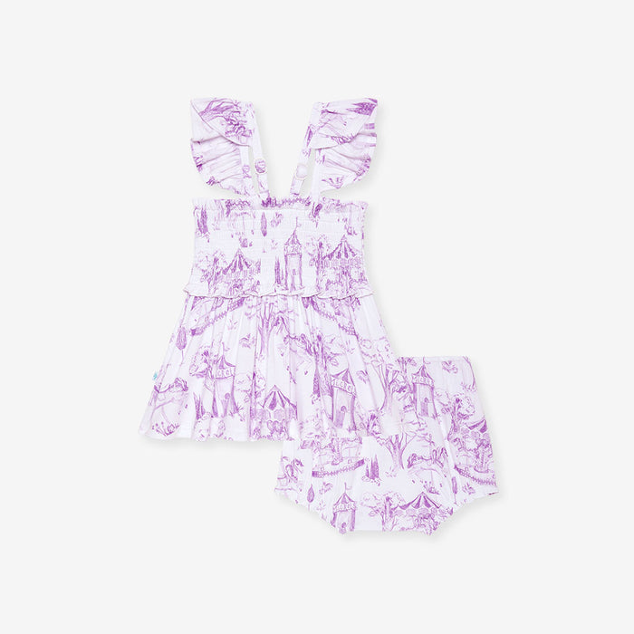 Purple and white patterned short set on a light gray background