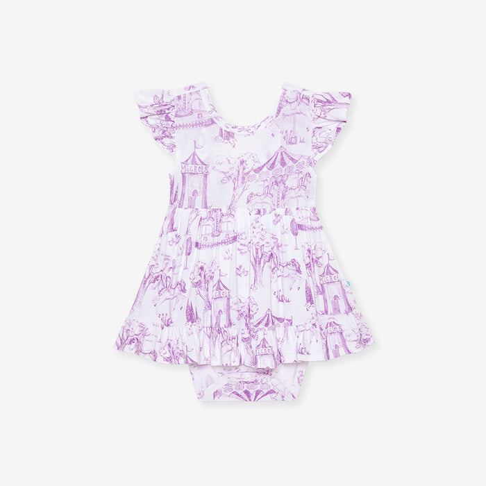 Purple and white patterned baby dress on a white background