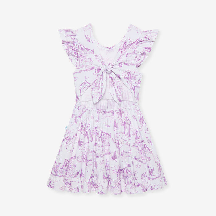 White dress with pink floral pattern on a white background