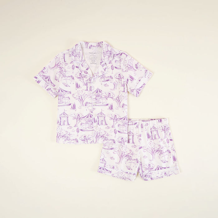 Purple patterned pajama set on a beige background