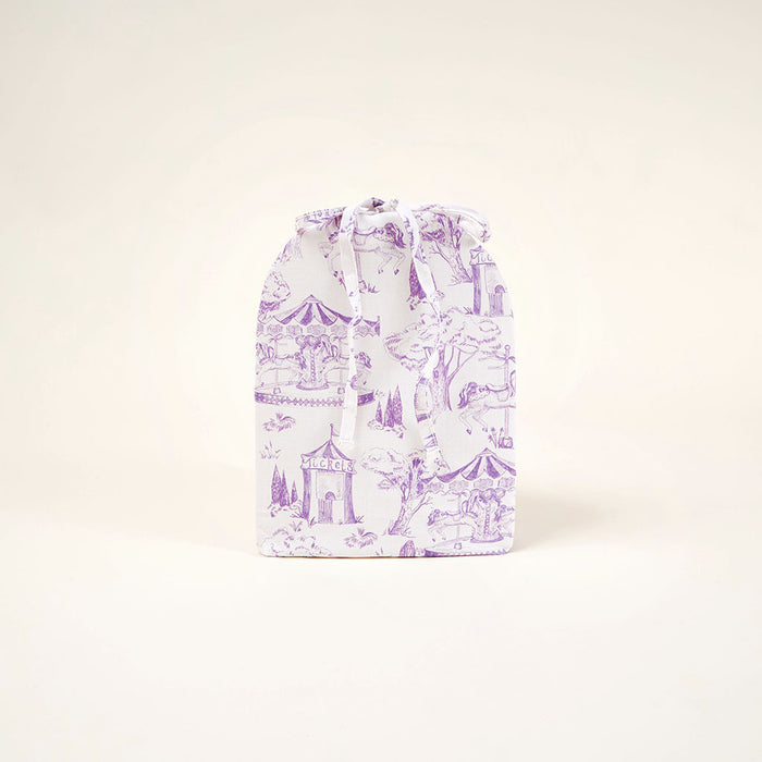 Drawstring bag with purple and white pattern on a light beige background