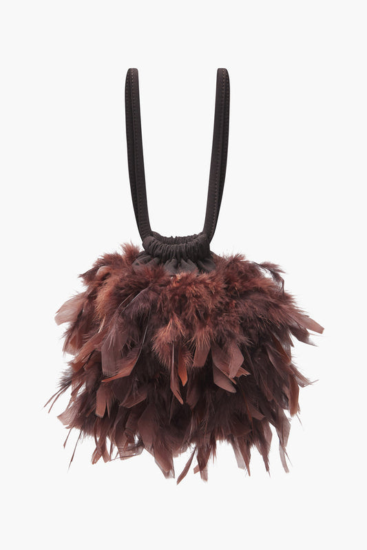 Bolso Bruna Plumas Marrón de Lady Pipa para completar looks de invitada.