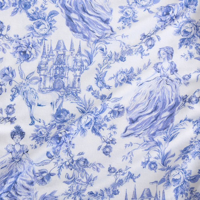 Blue floral and castle pattern on white fabric