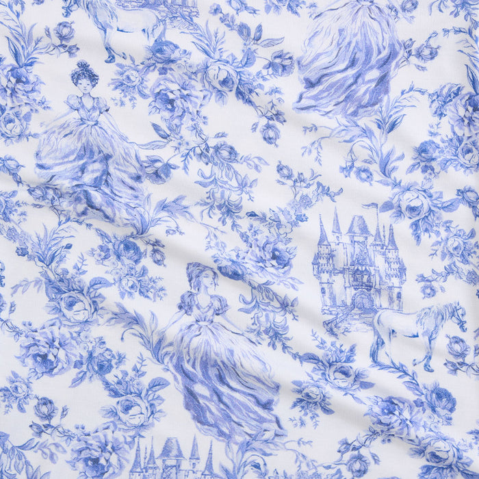 Blue floral and castle pattern on white fabric