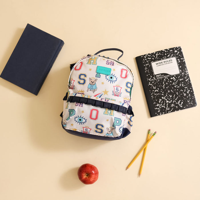 Backpack with Posh letter design surrounded by books and an apple on a beige background