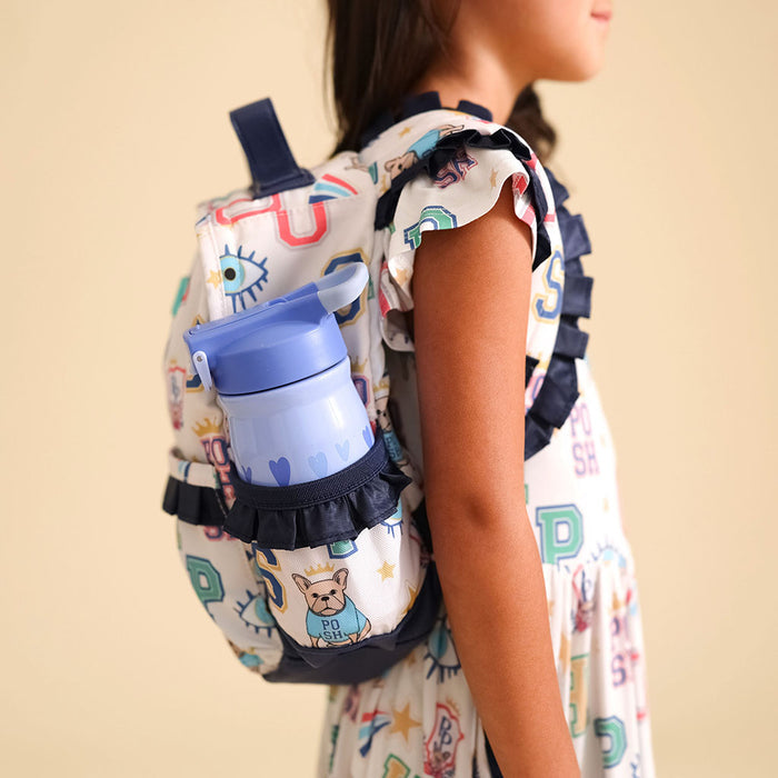 Child wearing a colorful backpack with a blue water bottle attached, on a beige background