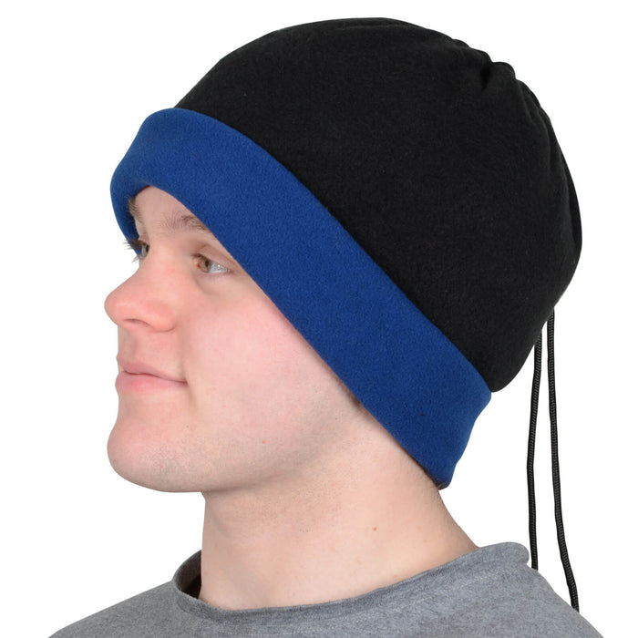 Person wearing a black and blue beanie hat