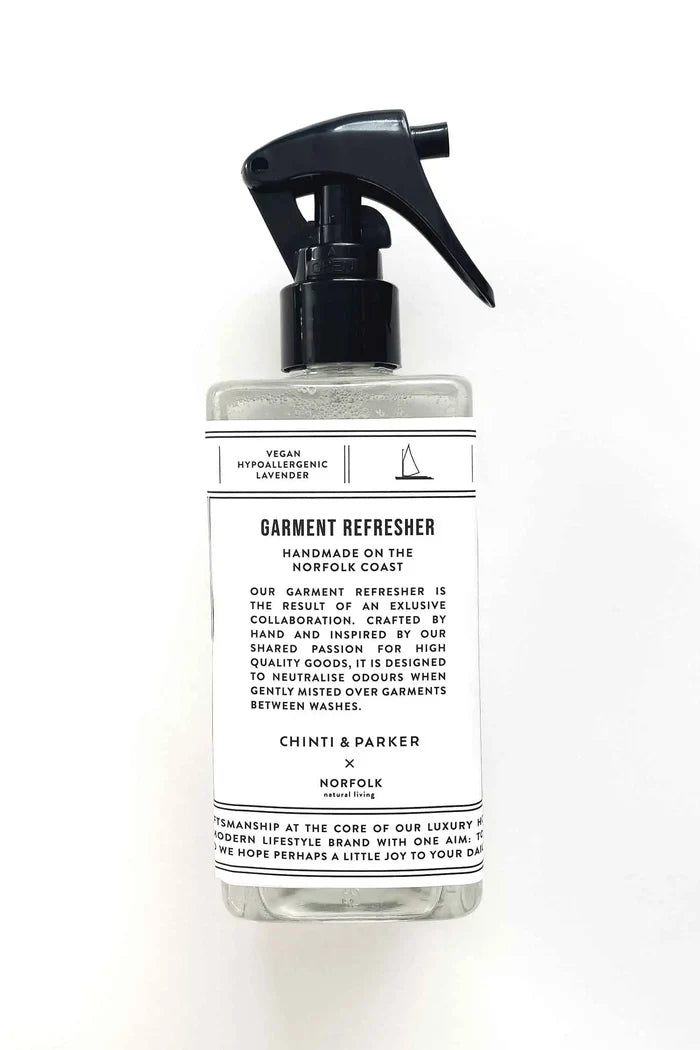 Garment refresher bottle with a label on a white background
