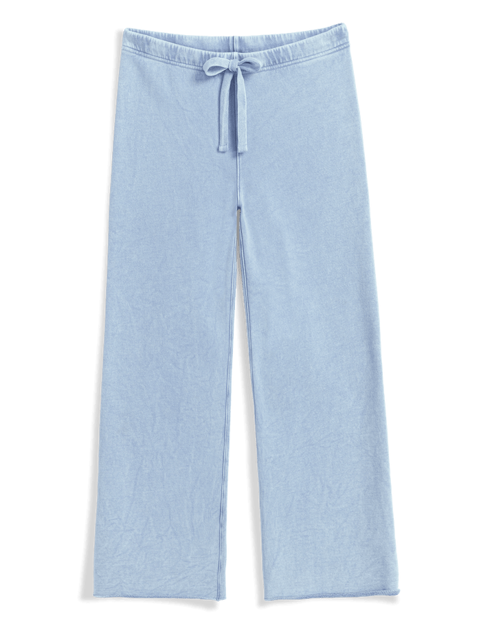 Light blue pants with a drawstring on a black background