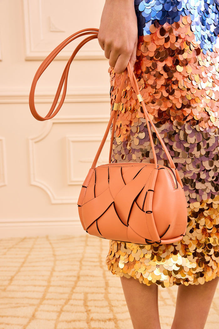 Designer Rose Woven Leather Charlotte Camera Bag Held by Model - Close Up | Ulla Johnson