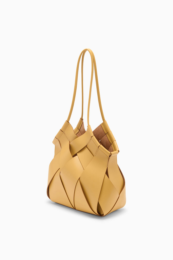 Lotus Yellow Artisanal Leather Charlotte Bag - Side Angle | Ulla Johnson