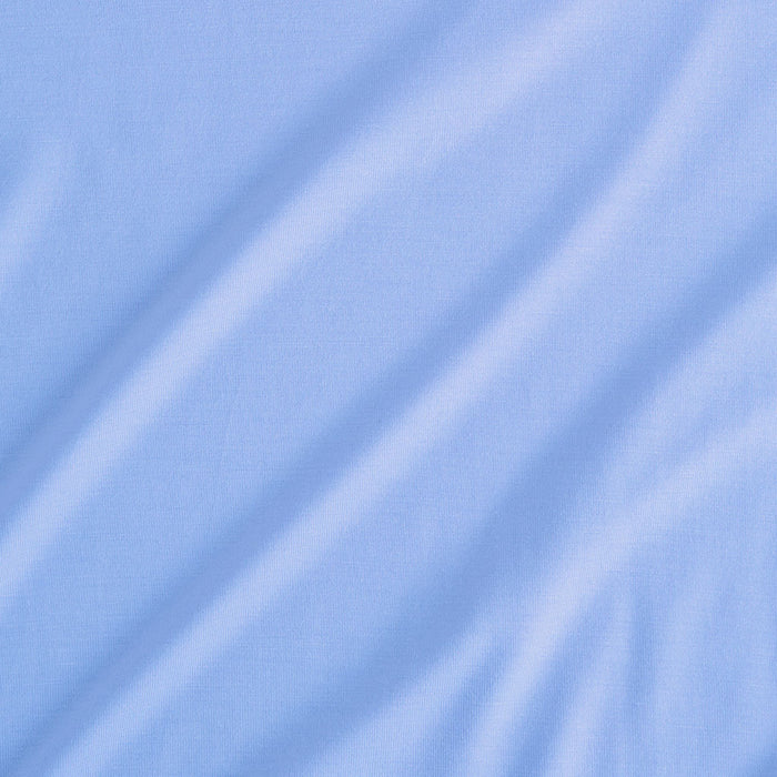 Close-up of the solid Chatham Blue fabric texture on Posh Peanut's bamboo viscose knit.