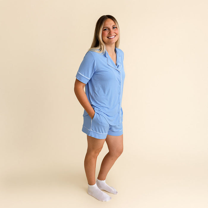 Woman standing wearing the Posh Peanut Chatham Blue Women's Luxe Pajama Short Set.