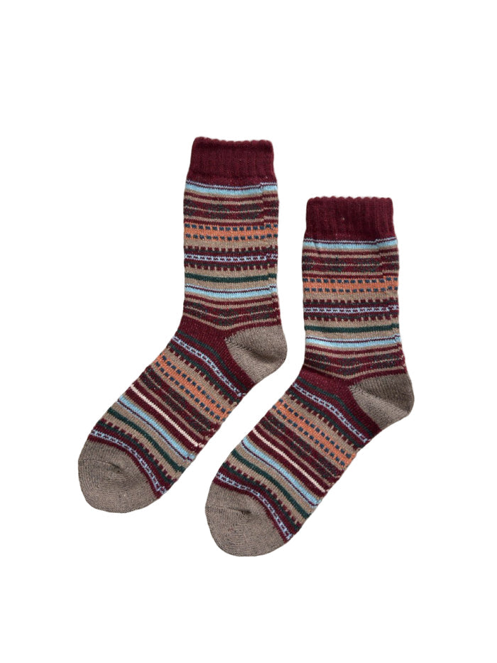 Chestnut Loom socks close-up showing textured wool-blend knit in burgundy and warm tan