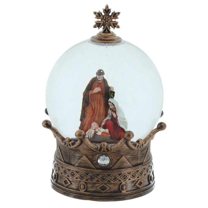 Decorative snow globe with religious scene on a white background