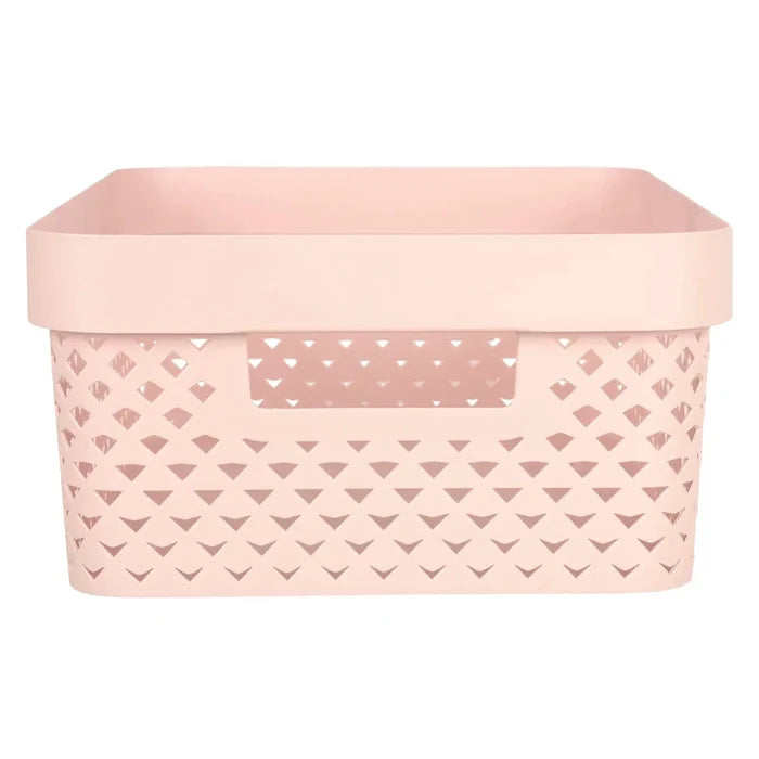 Side view of handle and pattern on a small pink Curver Pure storage basket