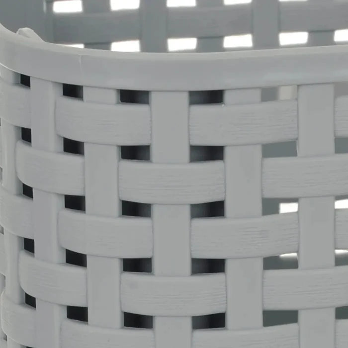 Close up of a woven design plastic grey storage basket for craft supplies