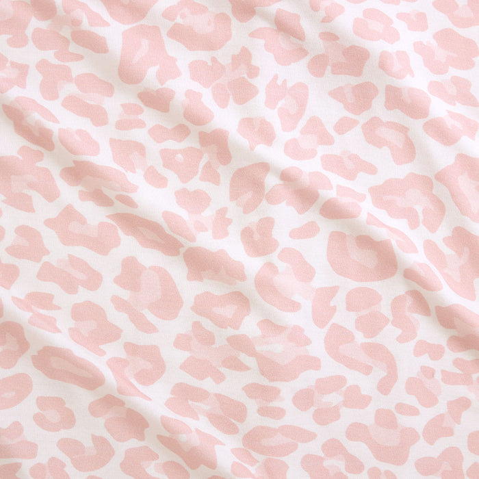 Pink and white patterned fabric texture