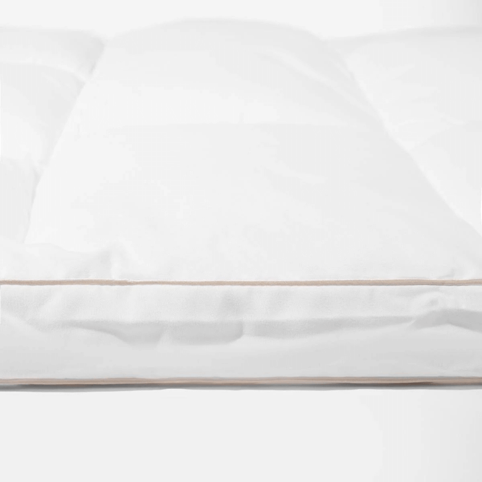 White topper with a thin gold stripe on a white background