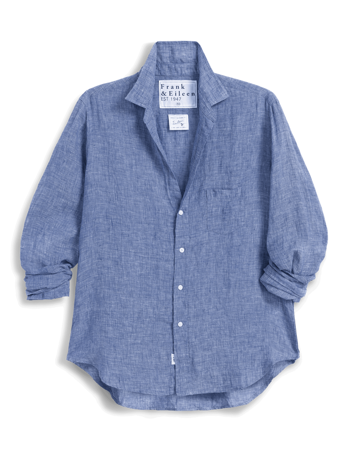 Blue shirt with rolled-up sleeves on a white background