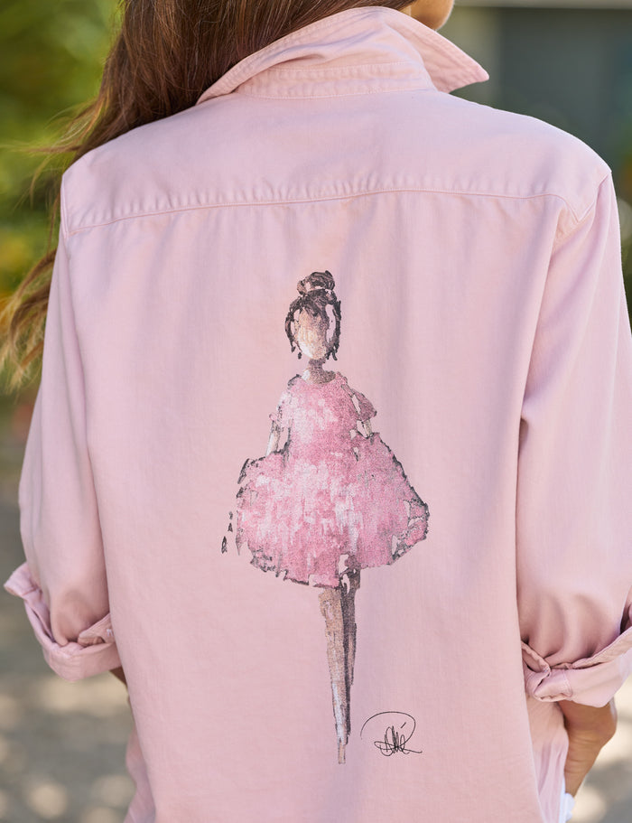 Pink jacket with a graphic of a woman in a pink dress on the back.