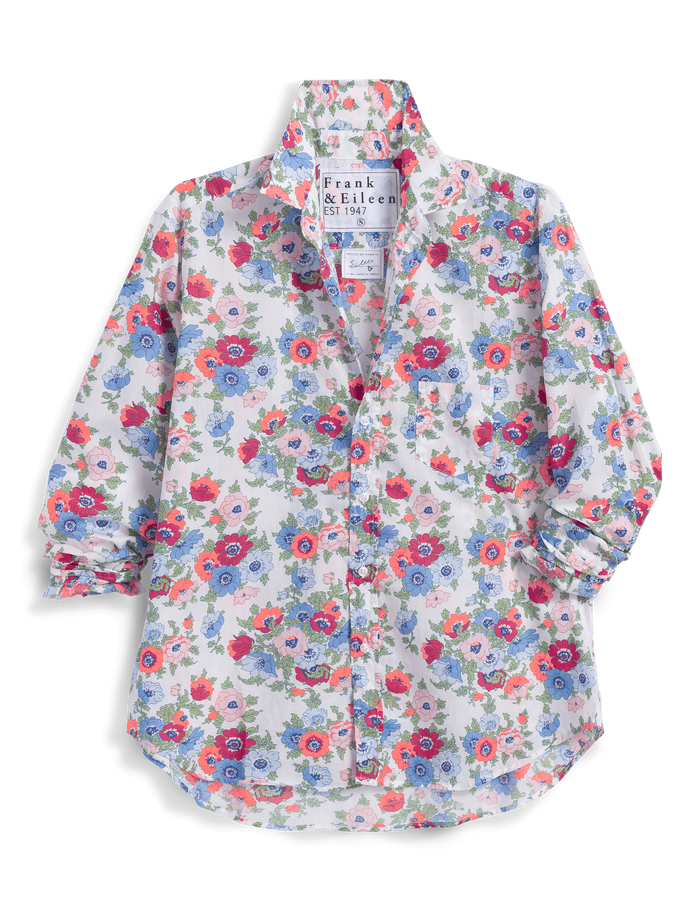 Floral patterned shirt with brand label on a white background