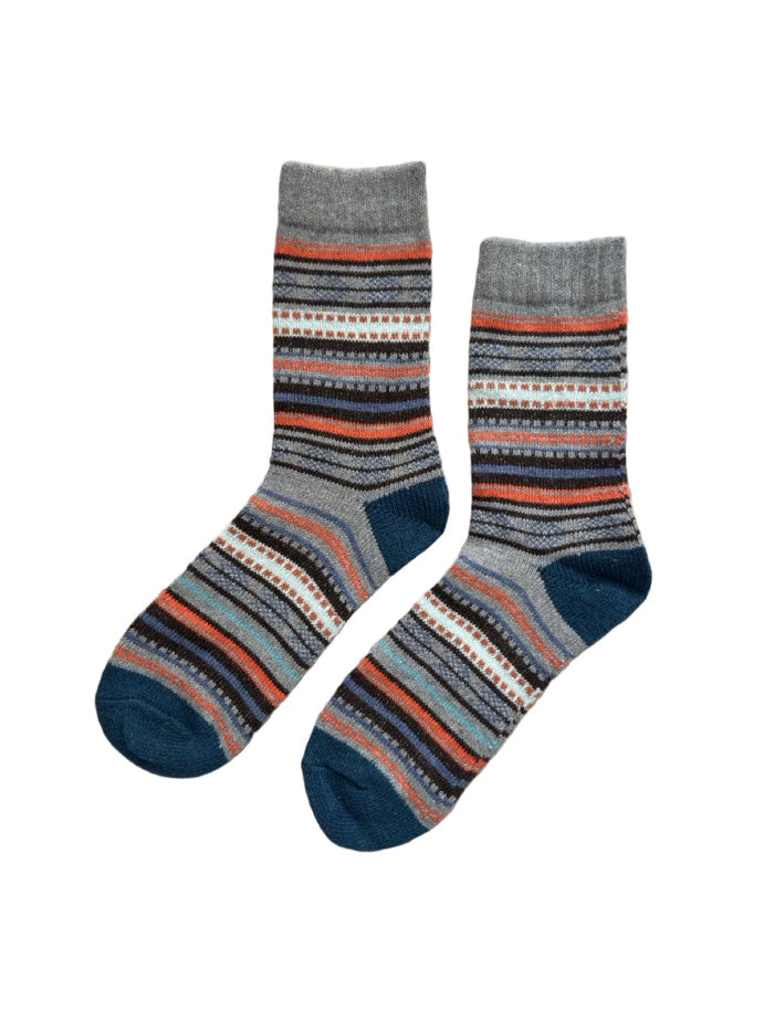 Frost Loom socks close-up showing cool-toned wool-blend knit construction in grey, navy, orange