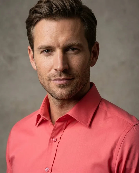 Man wearing a red shirt against a gray background