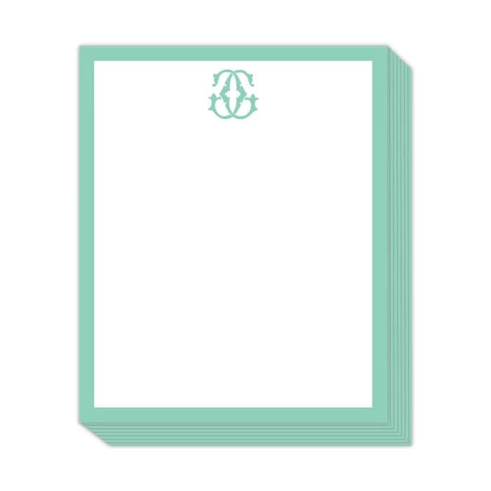 The Gift Bar - Short Stack Pad is crafted on premium text weight sheets, featuring a 5.25 x 6.5" white stationery paper with a decorative teal border and an intricate teal emblem at the top center.