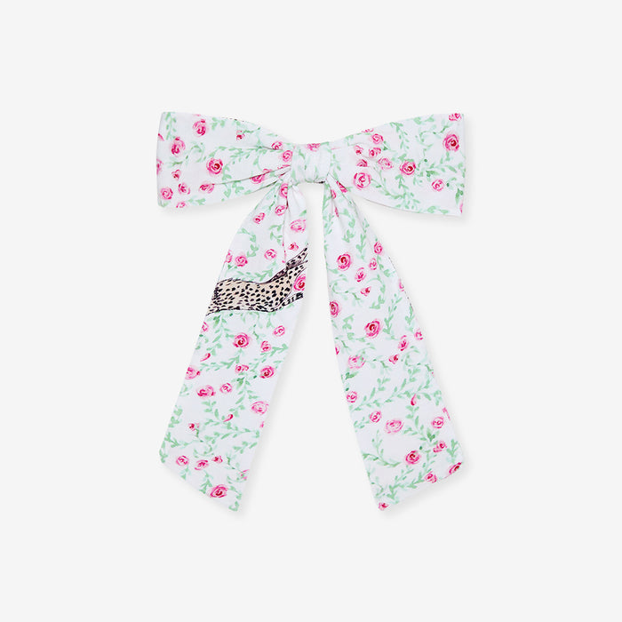 Floral bow with a leopard print center on a white background