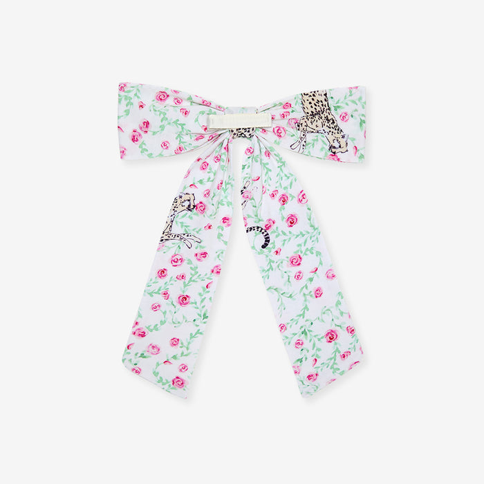 Floral patterned bow with animal prints on a white background