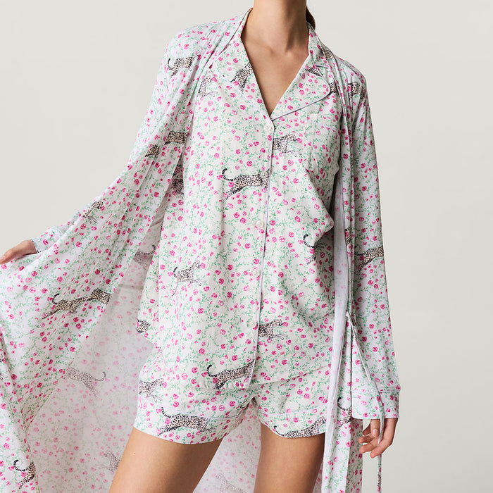Floral pajama set and robe with cat pattern on a neutral background