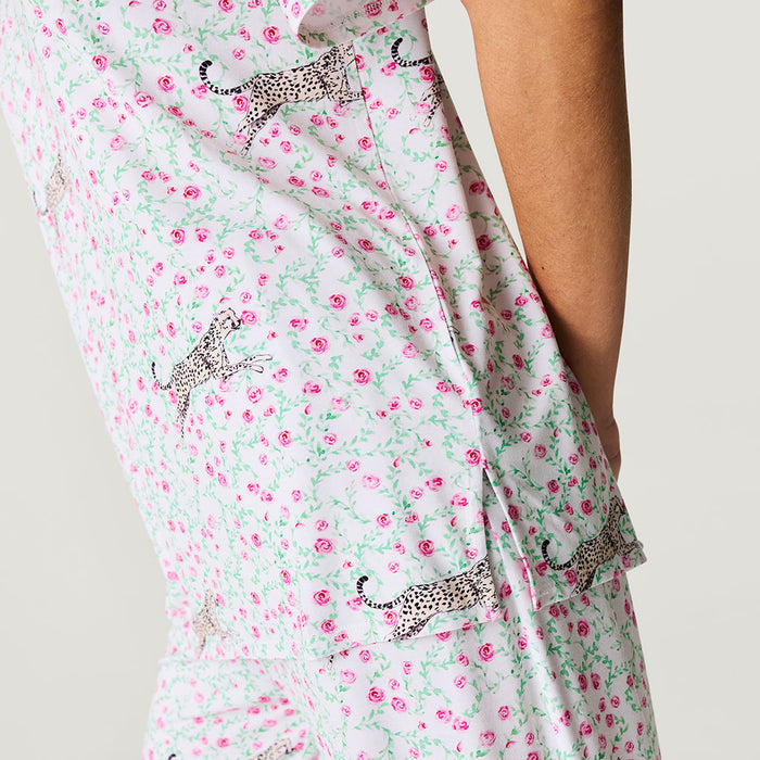 Floral top with small animal prints on a plain background