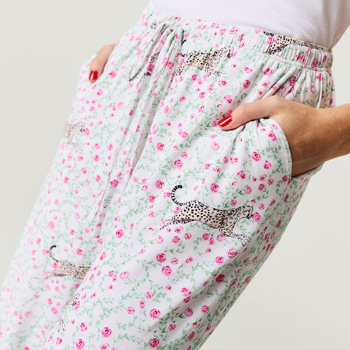Floral pants with animal prints on a plain background