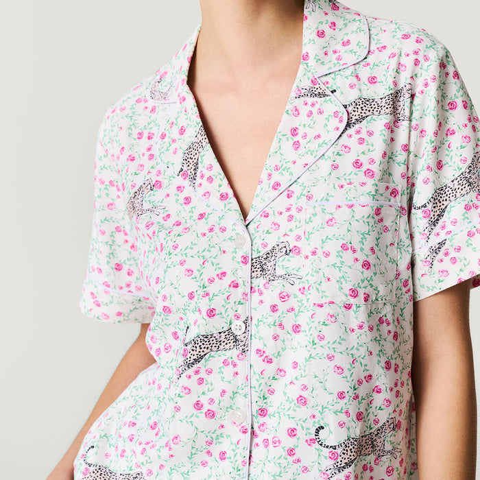 Floral and leopard print pajama top on a plain background
