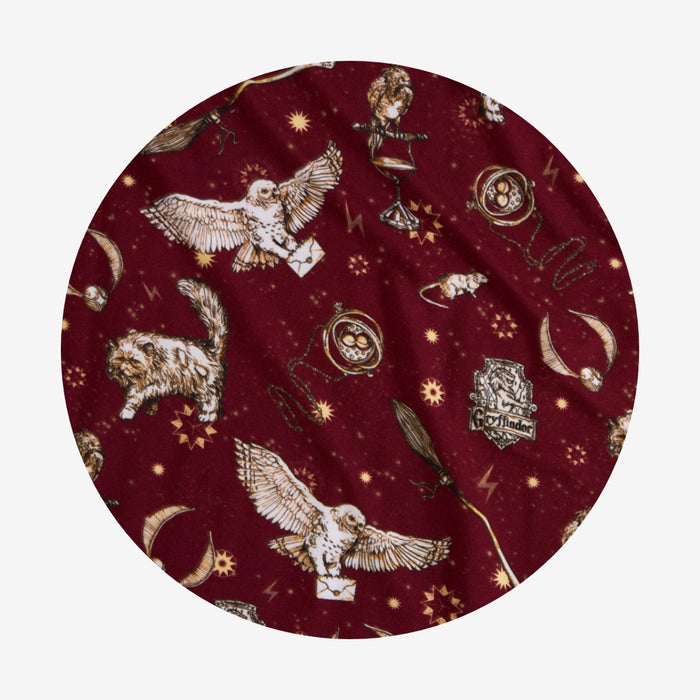 Round fabric swatch with Harry Potter-themed design on a red background