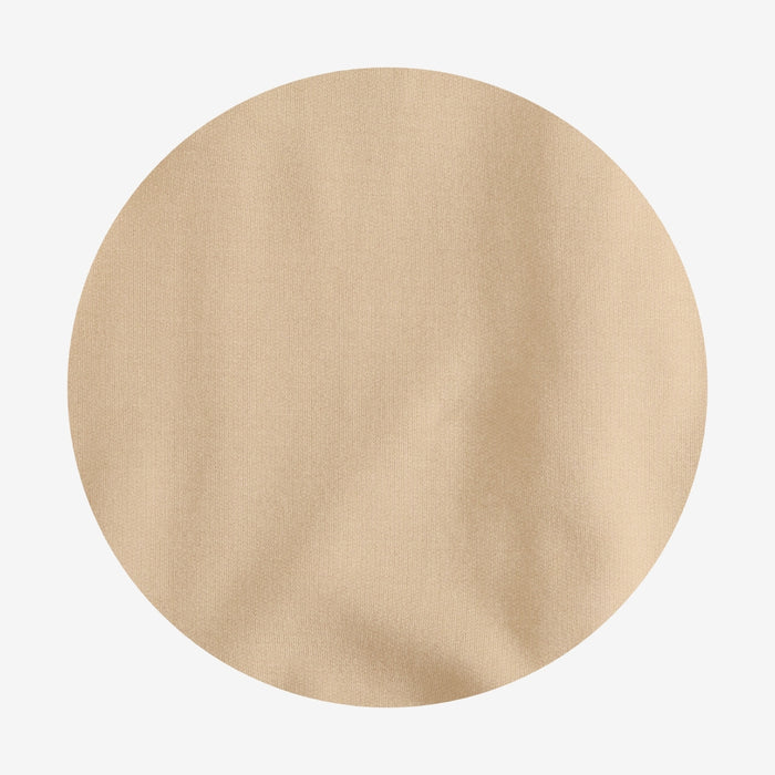 Beige circular fabric swatch on a light gray background