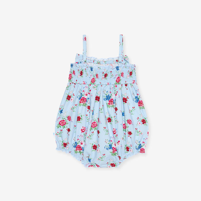 Floral baby romper on a light blue background