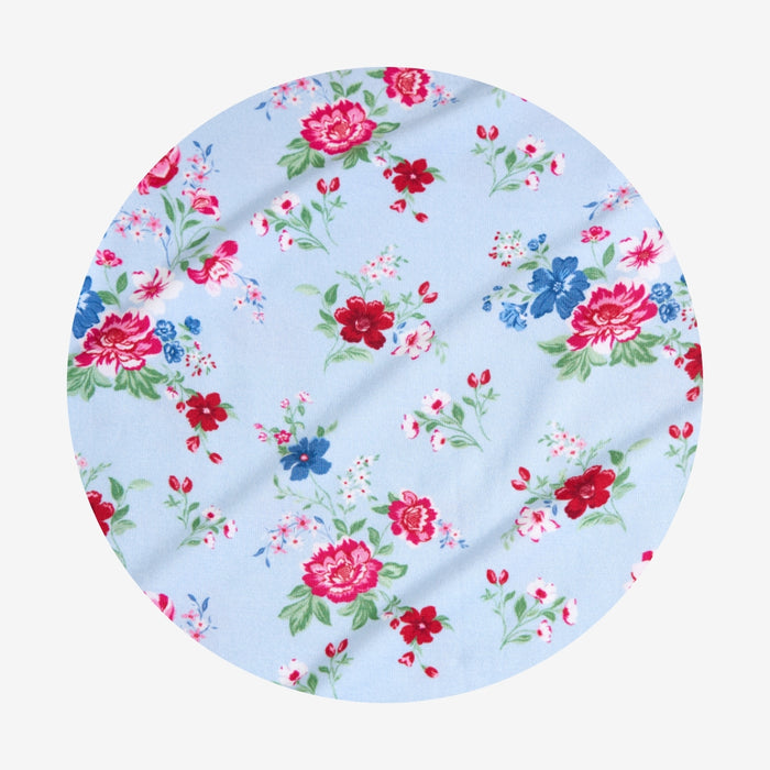 Floral-patterned fabric swatch on a light blue background